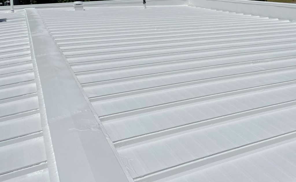 Close-up of a white corrugated metal roof.